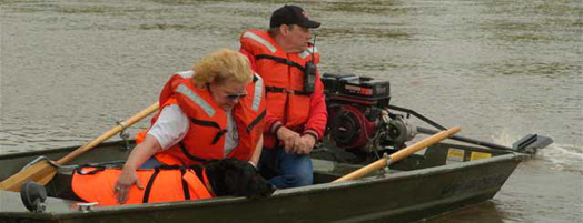 Dog and handler in search boat